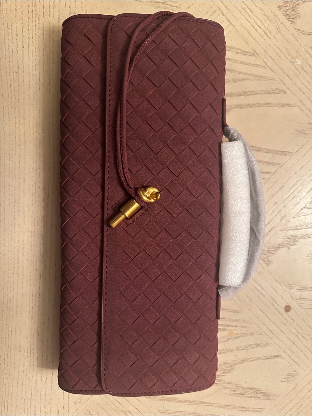 Woven Burgundy Clutch With Gold Accent